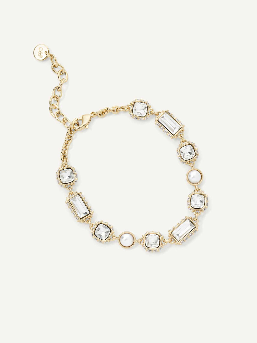 Gold bracelet with clear gemstones on a white background